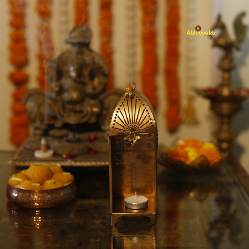 Decorative Traditional Mandir Tealight Holder Table Top with intricate design on a reflective surface for Diwali decor