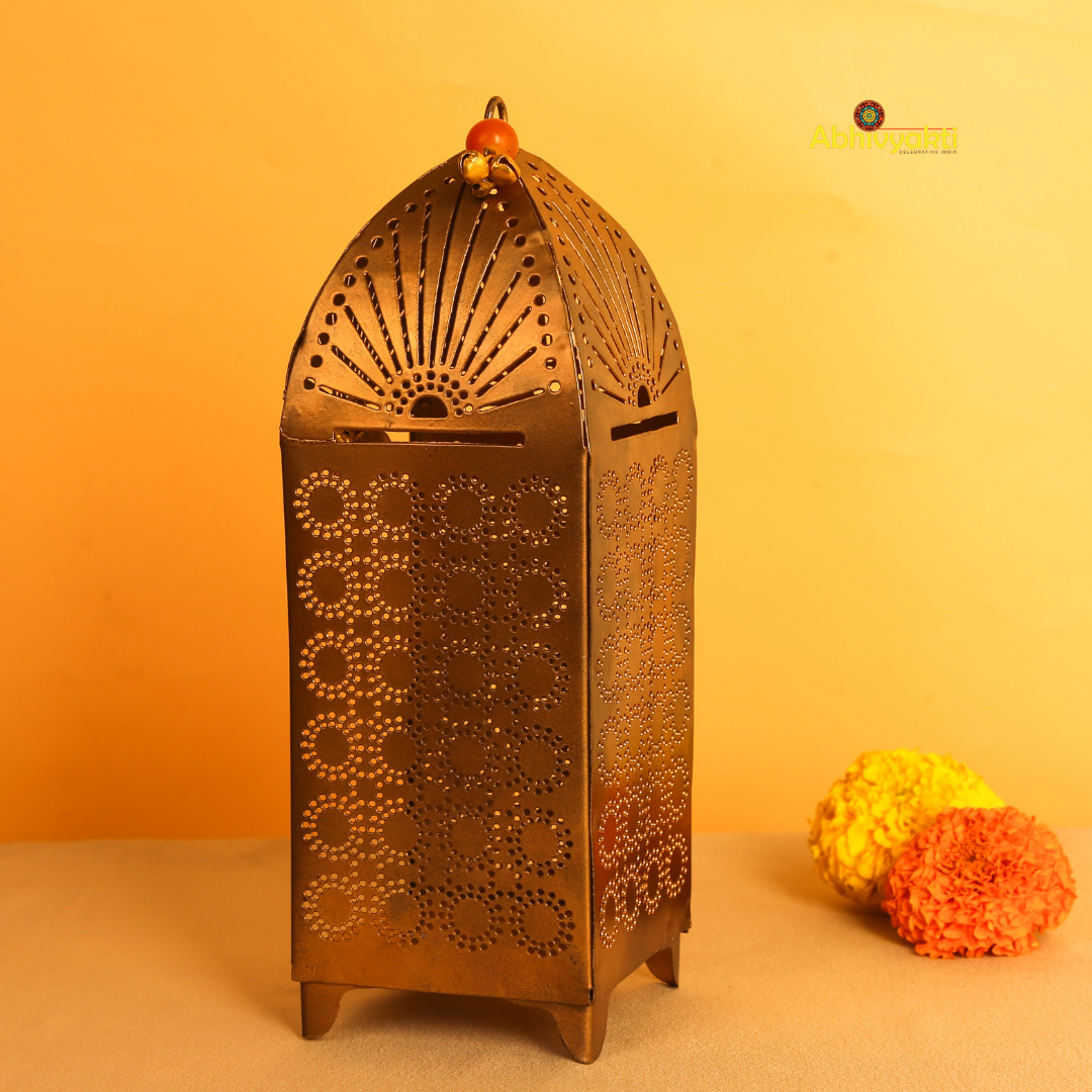 Decorative Traditional Mandir Tealight Holder Table Top with floral elements and a blurred and yellow background