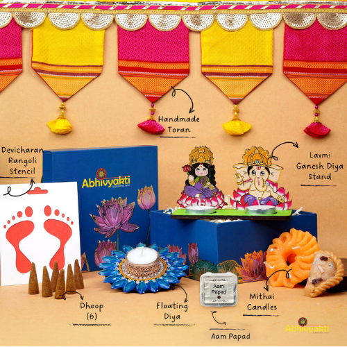 A festive Diwali hamper filled with an assortment of decorative items and treats. The hamper includes colorful floating diya, a box of mithai sweet candle, fragrant incense sticks, a small decorative toran, and festive Ganesh Lakshmi tealight alongwith tangy juicy mango roll up . The items are beautifully arranged in a festive box with vibrant, rich colors and intricate detailing, evoking the spirit of Diwali celebrations. The hamper is a perfect gift for the festive vibe