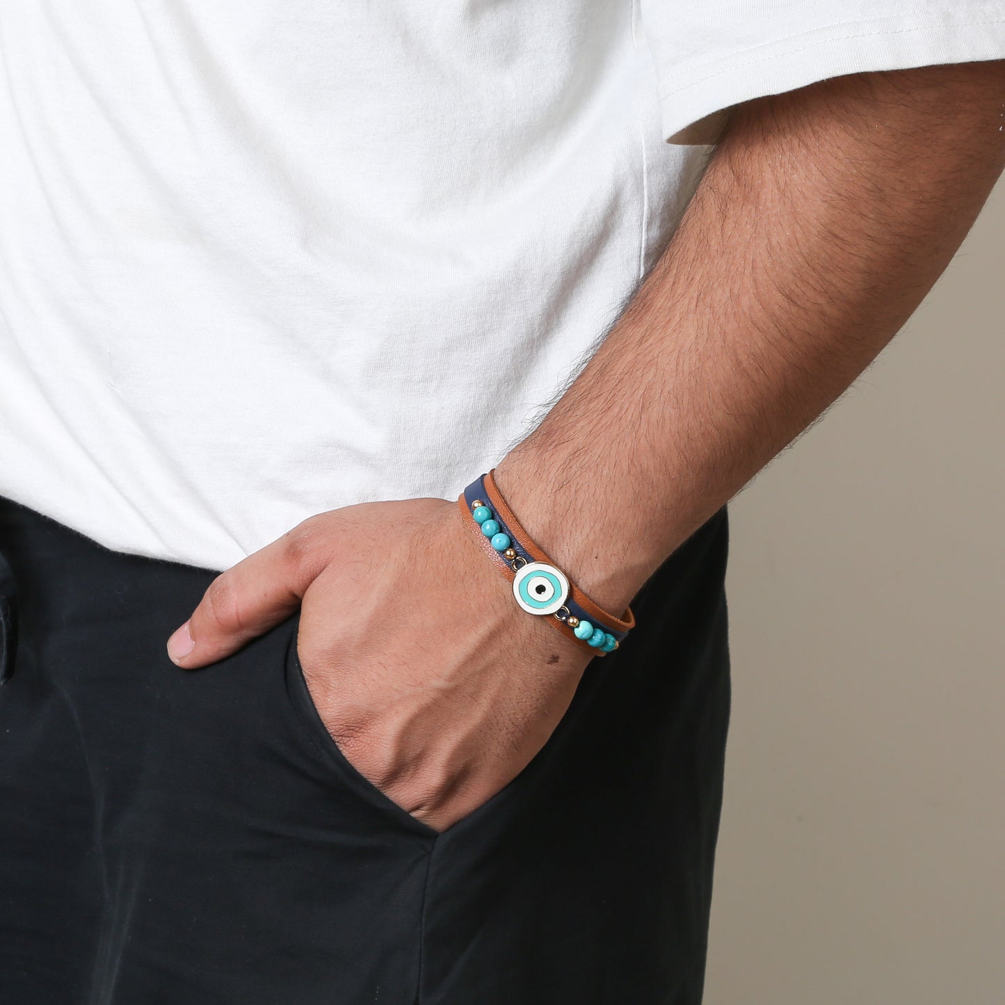 Crafted with precision, the bracelet comes with an adjustable strap, making it a perfect fit for every wrist. The evil eye charm, beautifully set in vibrant blues and whites, adds a pop of color and mystical allure to any outfit. Ideal for daily wear, it’s not just an accessory, but a reminder of positivity and well-being.