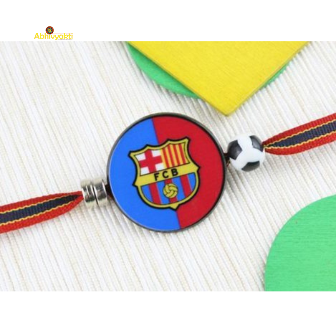 FC Barcelona themed Rakhi featuring the FCB logo on a round dial with a football bead and multicolored band perfect for young football fans.