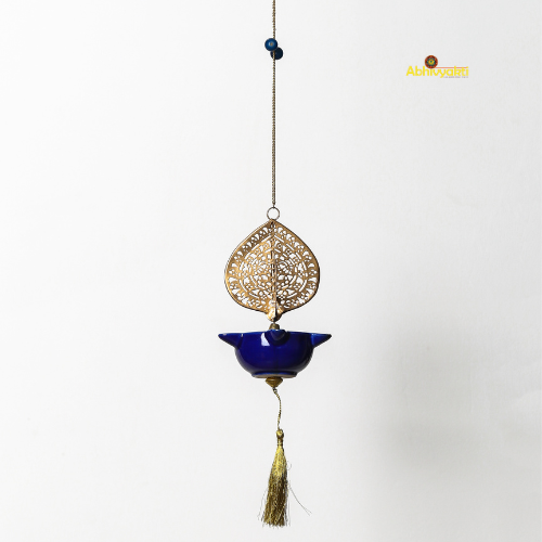 Decorative hanging ornament Peacock Swagata with blue bowl and gold filigree on a white background