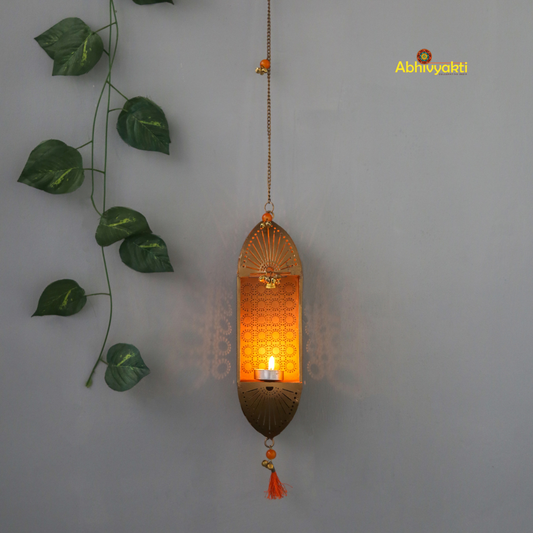 Decorative marigold garlands and a Traditional Mandir Hanging Tealight Holder on a white wall.