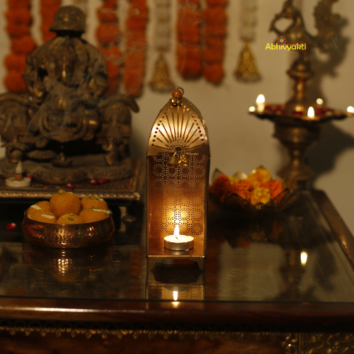 Decorative altar with Traditional Mandir Tealight Holder Table Top, candles, and offerings on a table.
