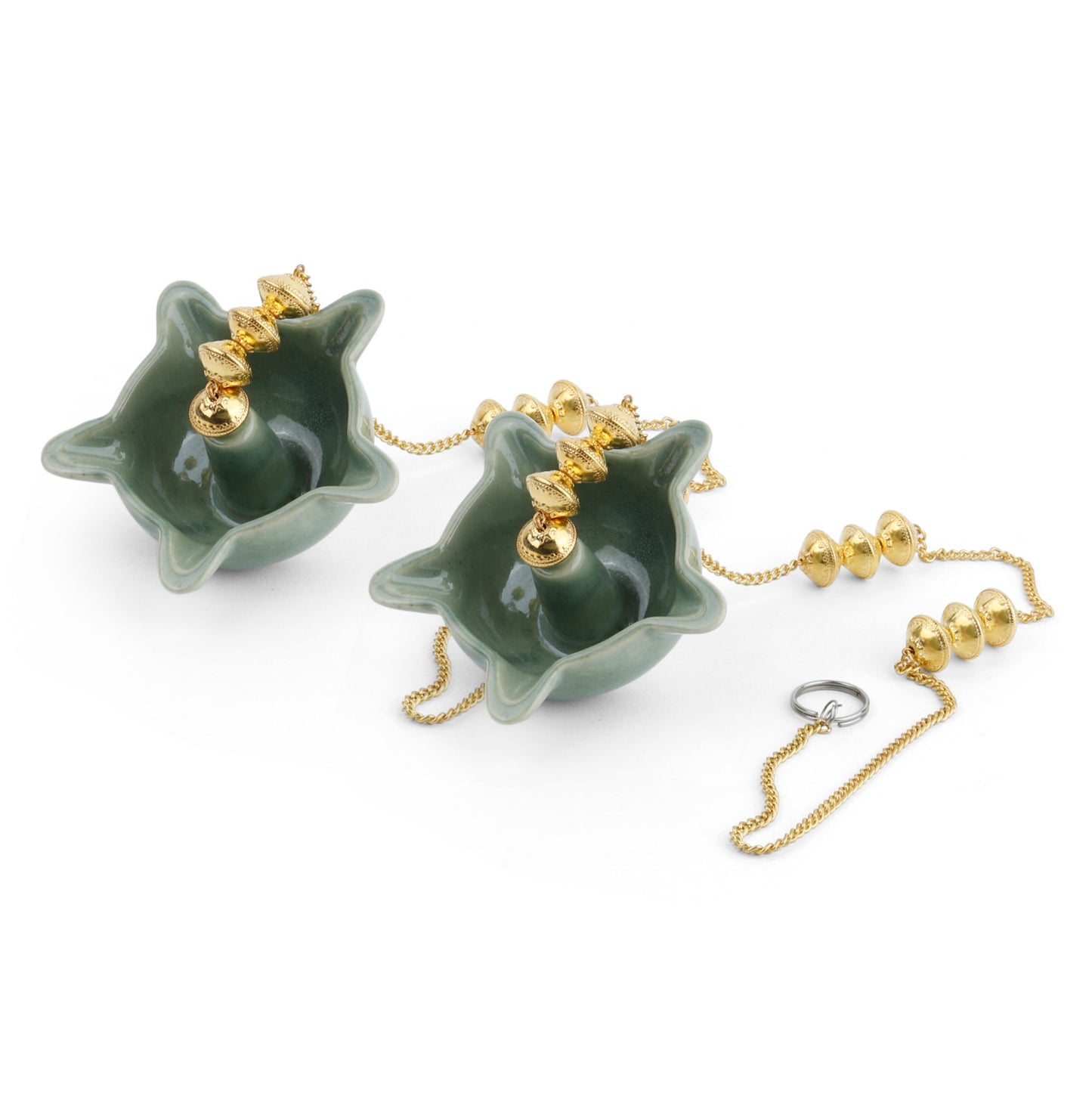 "Elegant wall-mounted Diwali diyas with intricate metal holders, designed to hang on the wall for a unique and stylish look. The diyas cast a soft, flickering light, creating a serene and festive ambiance for Diwali celebrations."