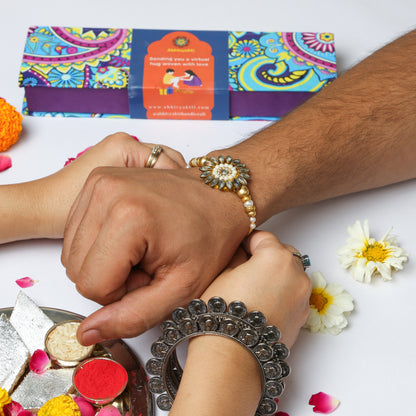 Celebrating rakshabandhan with sister tying beautiful Kundan floral rakhi to her brother