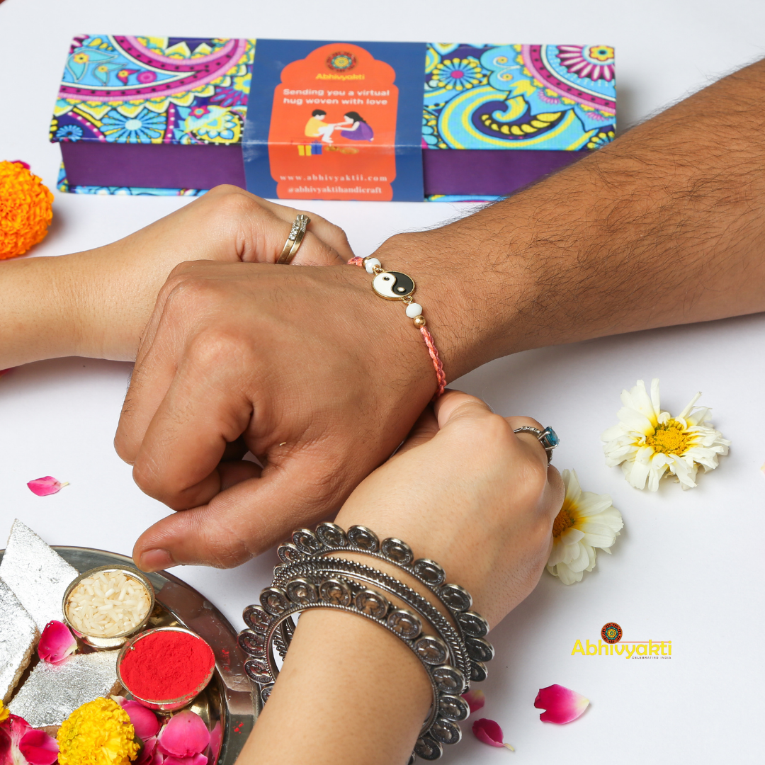 Celebrating rakshabandhan with sister tying beautiful YIN-YANG rakhi to her brother