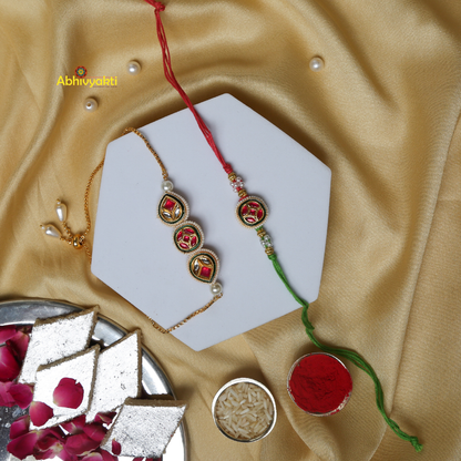 Rakhi and lumba embellished with gold and green beads, displaying a special design with stones and beads.