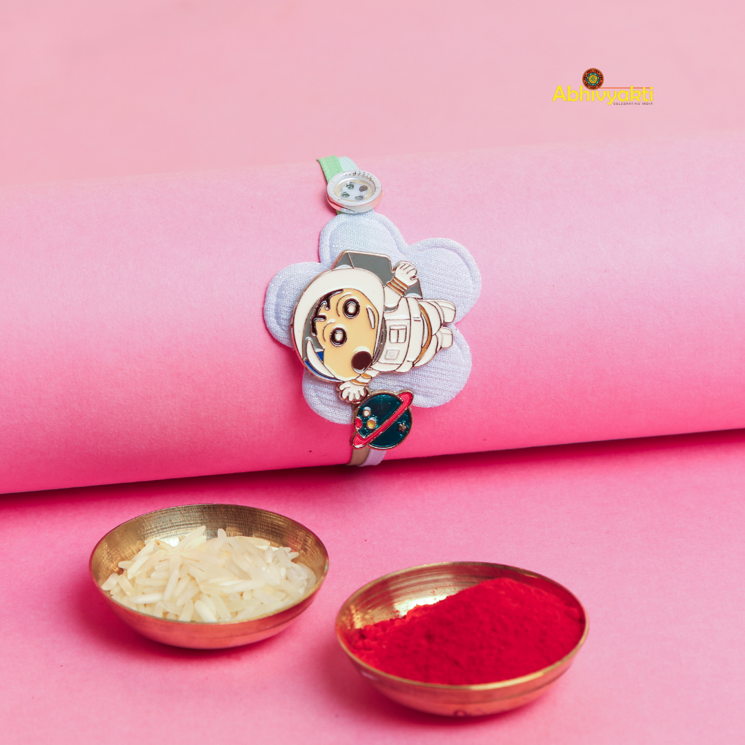 A vibrant Baby Astronaut Kids Rakhi bracelet for children, adorned with a cheerful cartoon character design, and comes with two bowls of roli and rice.