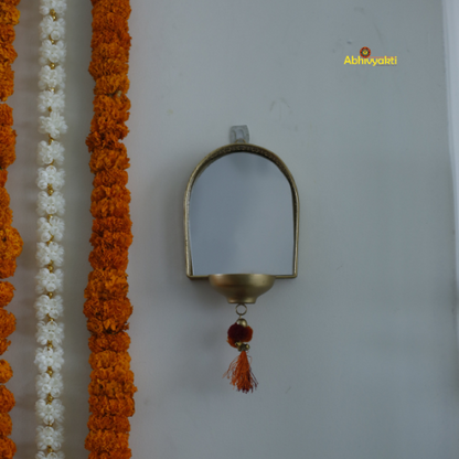 Decorative garland with a Mirror Tealight Holder on a white background