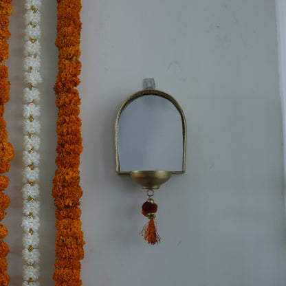 Decorative garland with a Mirror Tealight Holder on a white background