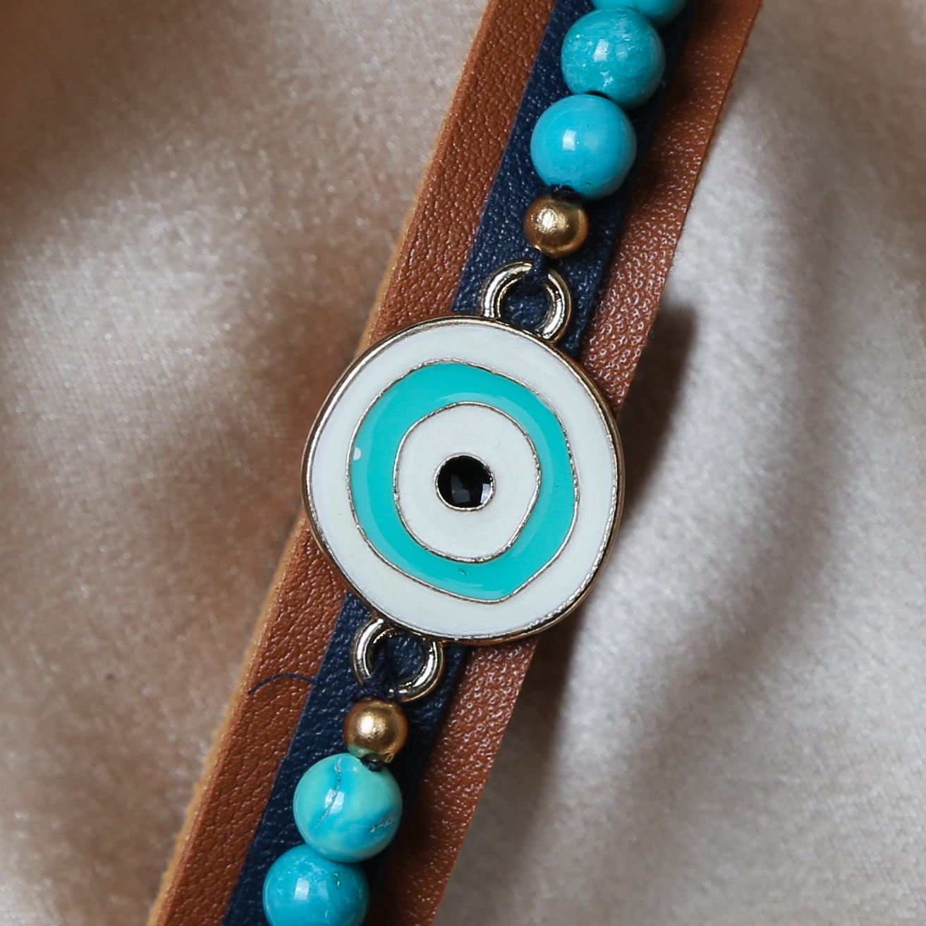 Crafted with precision, the bracelet comes with an adjustable strap, making it a perfect fit for every wrist. The evil eye charm, beautifully set in vibrant blues and whites, adds a pop of color and mystical allure to any outfit. Ideal for daily wear, it’s not just an accessory, but a reminder of positivity and well-being.