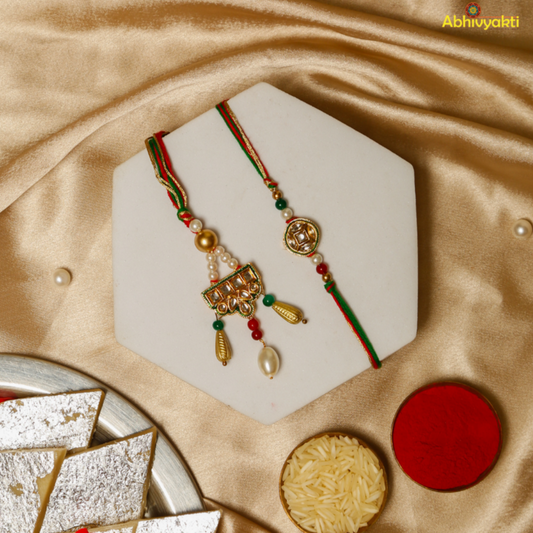 A pair of gold and green rakhi lumba embellished with pearls, stones, and beads, representing sibling bonds and celebration