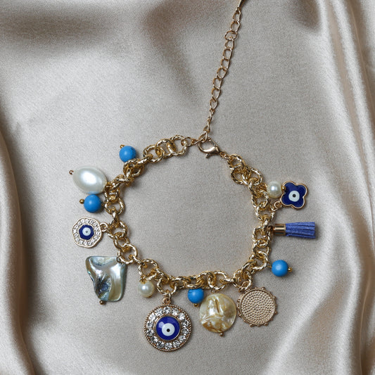 Crafted with precision, the bracelet comes with a soft lobster claw clasp, making it a perfect fit for every wrist. The evil eye charm, beautifully set in vibrant blues and whites, adds a pop of color and mystical allure to any outfit. Ideal for daily wear, it’s not just an accessory, but a reminder of positivity and well-being.