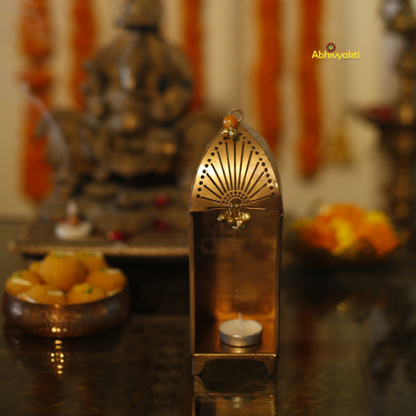 Decorative Traditional Mandir Tealight Holder Table Top with floral elements and a blurred and blured background