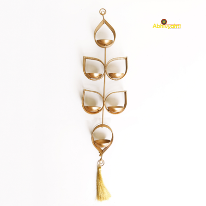 Tulsi - Wall Hanging Tealight Holder and orange beaded floral toran on a white background