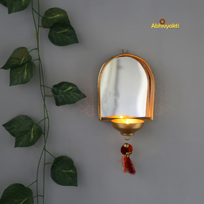 Wall Mirror tealight holder diya lit up on white wall