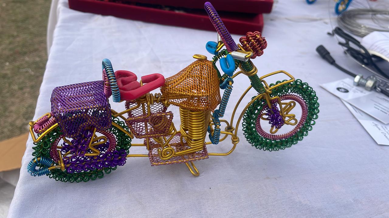 A handmade wire motorbike decor piece crafted with intricate detailing. The wire frame captures the sleek and dynamic shape of a motorbike, showcasing fine craftsmanship. Perfect for home decor or as a unique gift for bike enthusiasts