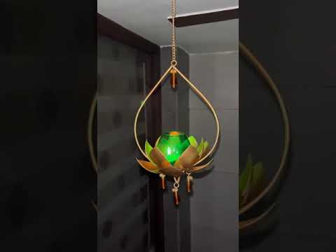 "Elegant wall-mounted Diwali diyas with intricate metal holders, designed to hang on the wall for a unique and stylish look. The diyas cast a soft, flickering light, creating a serene and festive ambiance for Diwali celebrations."
