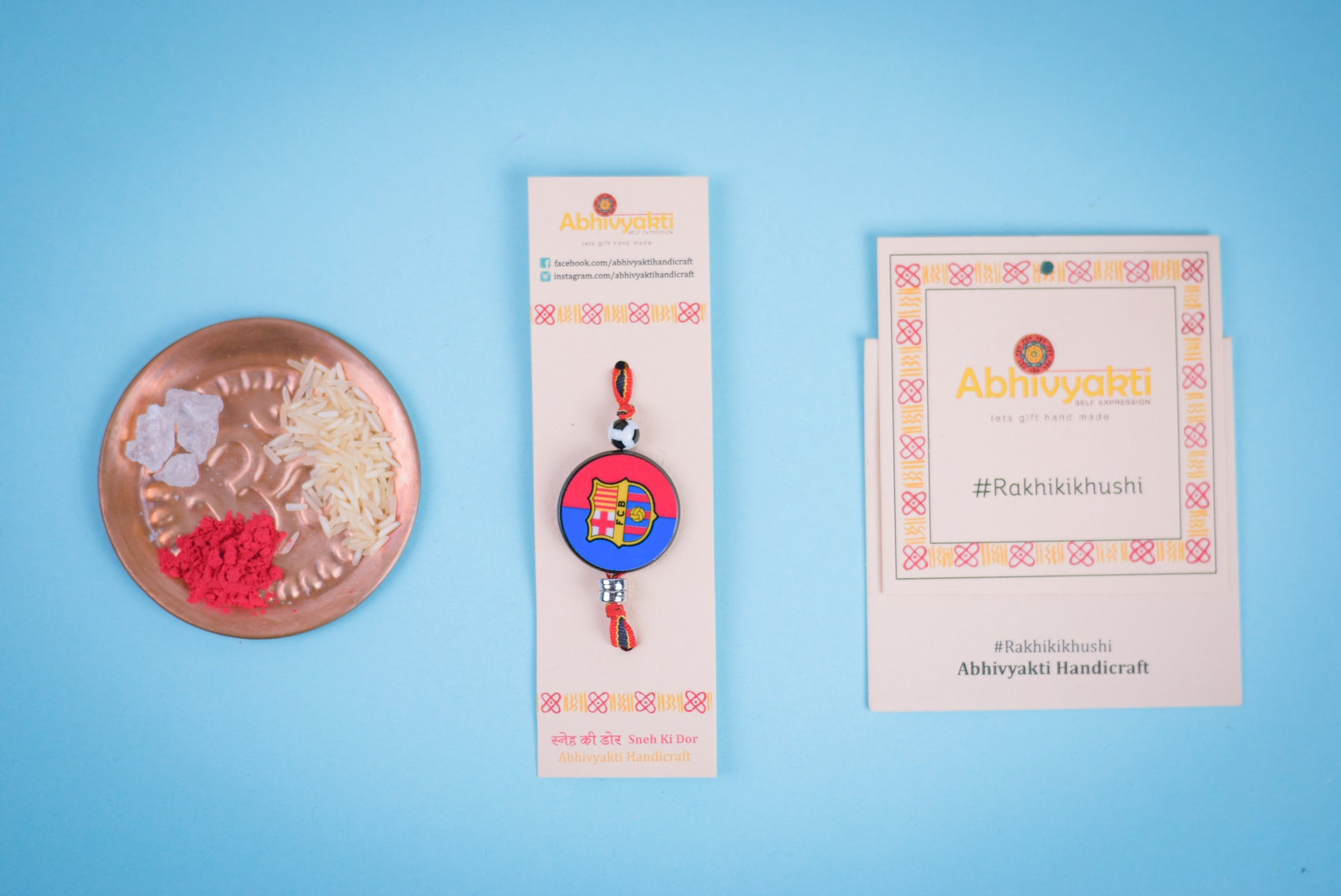 Lovely kids rakhi adorned with beads, showcasing Barcelona football badge on ribbon with soccer ball.
