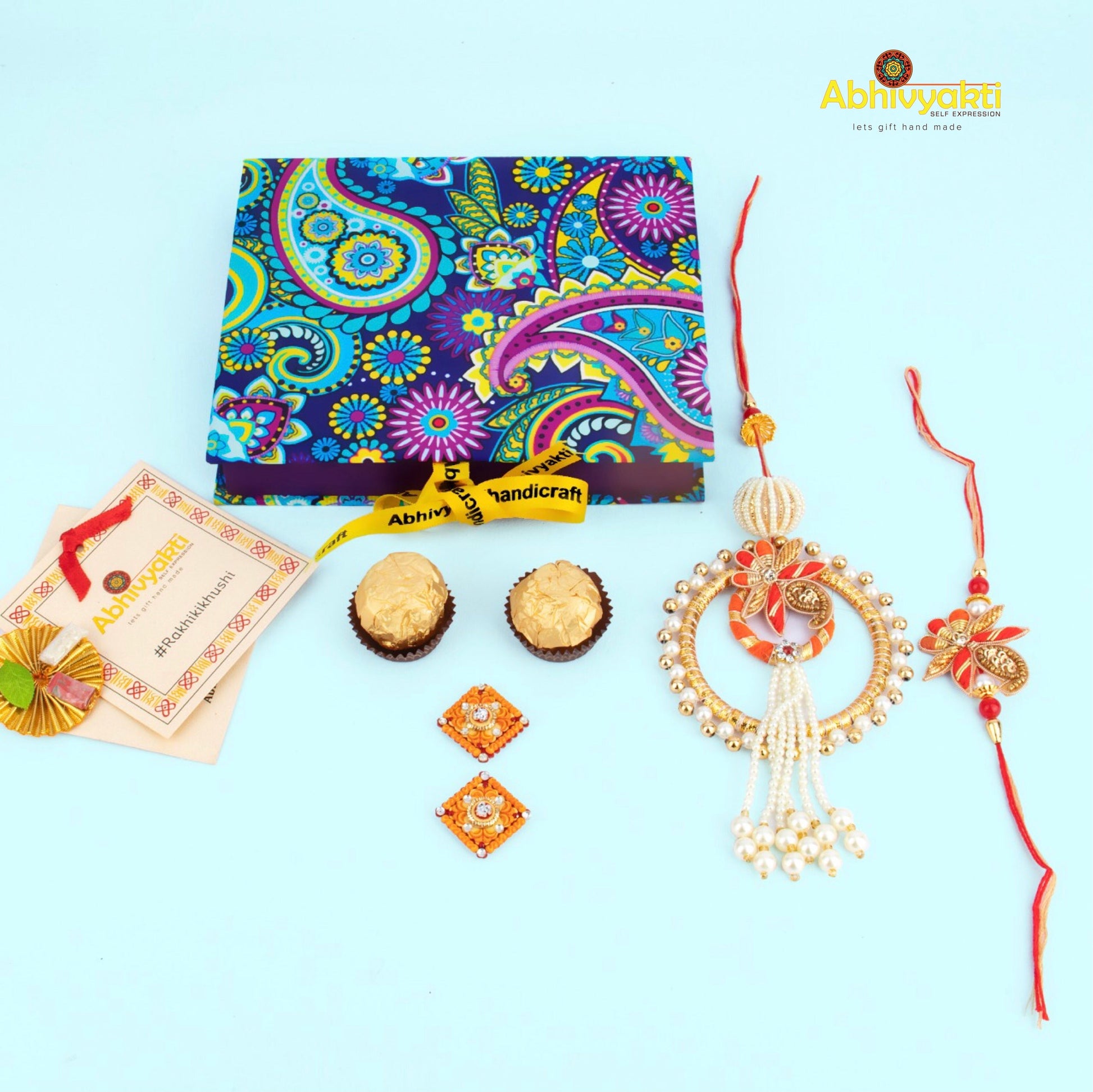 Elegant red and white rakhi featuring pearls and beads, a decorative lumba rakhi with stones & beads.