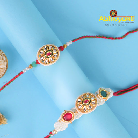 Golden Lumba Rakhi adorned with intricate beads, pearls, and a dangling tassel, symbolizing love and protection for sister-in-law during Raksha Bandhan. It reflects tradition and elegance, perfect for strengthening family bonds