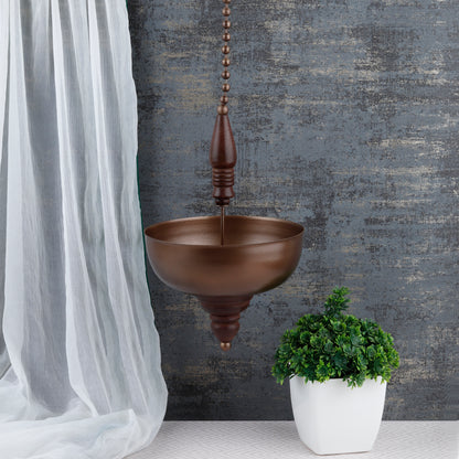 "Elegant wall-mounted Diwali diyas with intricate metal holders, designed to hang on the wall for a unique and stylish look. The diyas cast a soft, flickering light, creating a serene and festive ambiance for Diwali celebrations."