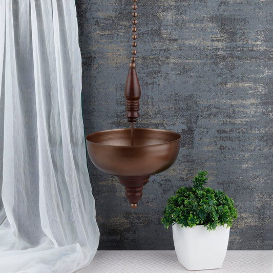 "Elegant wall-mounted Diwali diyas with intricate metal holders, designed to hang on the wall for a unique and stylish look. The diyas cast a soft, flickering light, creating a serene and festive ambiance for Diwali celebrations."