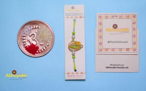 Pearl Rakhi india with roli chawal tikka
