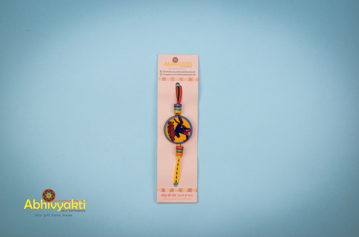 Rakhi for kids featuring Spiderman design and lovely beads.