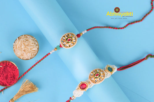 Rakhi lumba with stunning beads, stones, and unique design on blue background.