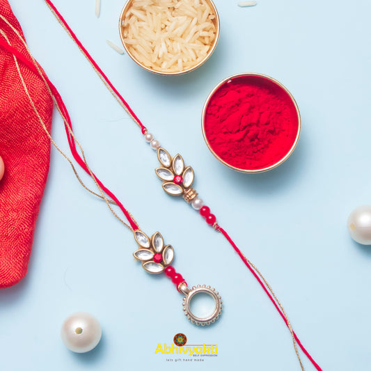 Elegant red rakhi with pearl and pearl necklace, showcasing Rakhi lumba design with stone and beads.