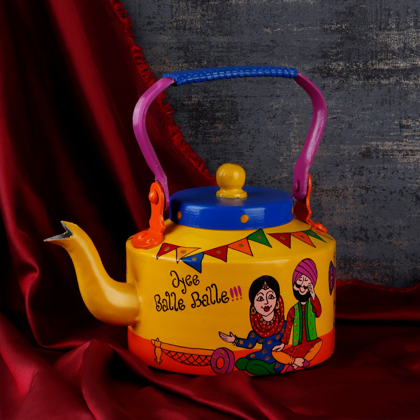 "A vibrant, handpainted kettle with quirky designs and bold colors, featuring intricate Indian folk art. The kettle is adorned with playful motifs and patterns, perfect as a decorative statement piece for a creative and culturally inspired home."
