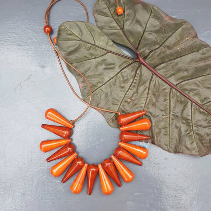 Beautifully Hand crafted seasons gift from the land of Channapatna. These Boho Wooden Adjustable Necklaces are going to be a great festive fashion concept for you !

They are made of sustainable wood with lacquered finish has a distinctive, nostalgic style. Each and every color is completely safe and are made from non-toxic vegetable colors.