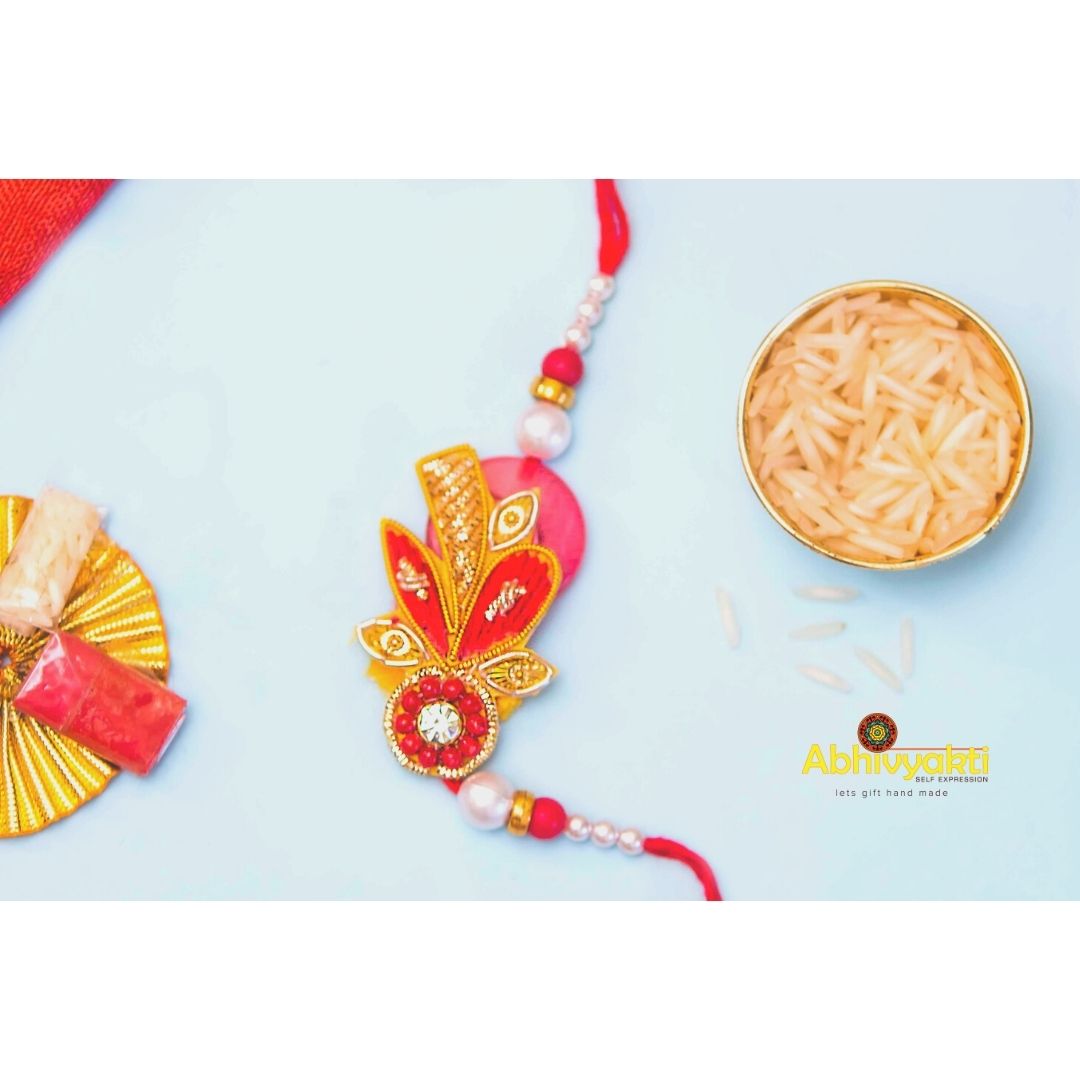 Green thread, zardozi thread and crystal rakhi 