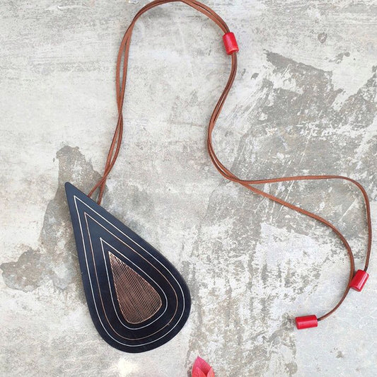 Our foray into the exquisite silver inlay craft of Bidri has always be unique and original. Waterdrop Boho Bidri Adjustable Necklace is inspired from the theme of water and the ever needful drop that quenches our universe.

These statement pieces are handcrafted in Bidar, North Karnataka. This piece is an ode to the waves of the sea. The metal used is a blackened alloy of zinc and copper inlaid with thin sheets of pure silver, brass and copper. Any imperfections on it are part of the handmade process 