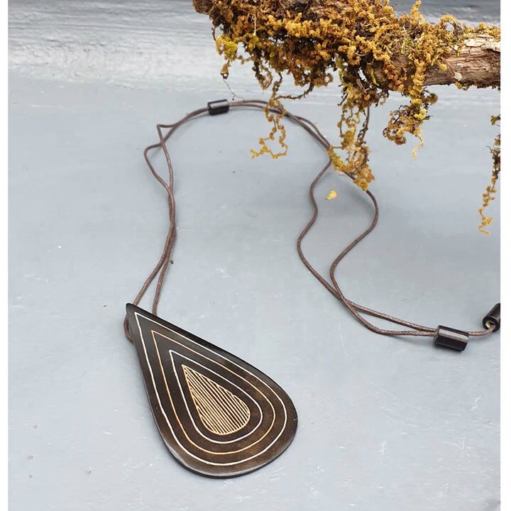 Our foray into the exquisite silver inlay craft of Bidri has always be unique and original. Waterdrop Boho Bidri Adjustable Necklace is inspired from the theme of water and the ever needful drop that quenches our universe.

These statement pieces are handcrafted in Bidar, North Karnataka. This piece is an ode to the waves of the sea. The metal used is a blackened alloy of zinc and copper inlaid with thin sheets of pure silver, brass and copper. Any imperfections on it are part of the handmade process involv