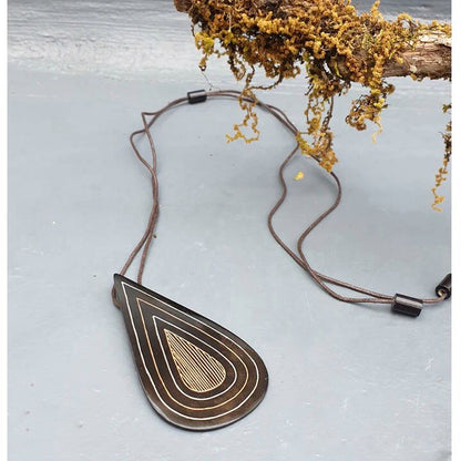 Our foray into the exquisite silver inlay craft of Bidri has always be unique and original. Waterdrop Boho Bidri Adjustable Necklace is inspired from the theme of water and the ever needful drop that quenches our universe.

These statement pieces are handcrafted in Bidar, North Karnataka. This piece is an ode to the waves of the sea. The metal used is a blackened alloy of zinc and copper inlaid with thin sheets of pure silver, brass and copper. Any imperfections on it are part of the handmade process involv