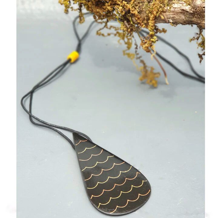 Our foray into the exquisite silver inlay craft of Bidri has always be unique and original. Waterdrop Boho Bidri Adjustable Necklace is inspired from the theme of water and the ever needful drop that quenches our universe.

These statement pieces are handcrafted in Bidar, North Karnataka. This piece is an ode to the waves of the sea. The metal used is a blackened alloy of zinc and copper inlaid with thin sheets of pure silver, brass and copper. Any imperfections on it are part of the handmade process involv