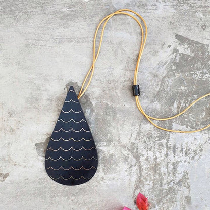 Our foray into the exquisite silver inlay craft of Bidri has always be unique and original. Waterdrop Boho Bidri Adjustable Necklace is inspired from the theme of water and the ever needful drop that quenches our universe.

These statement pieces are handcrafted in Bidar, North Karnataka. This piece is an ode to the waves of the sea. The metal used is a blackened alloy of zinc and copper inlaid with thin sheets of pure silver, brass and copper. Any imperfections on it are part of the handmade process involv