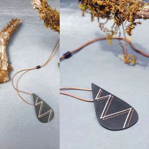 Our foray into the exquisite silver inlay craft of Bidri has always be unique and original. Waterdrop Boho Bidri Adjustable Necklace is inspired from the theme of water and the ever needful drop that quenches our universe.

These statement pieces are handcrafted in Bidar, North Karnataka. This piece is an ode to the waves of the sea. The metal used is a blackened alloy of zinc and copper inlaid with thin sheets of pure silver, brass and copper. Any imperfections on it are part of the handmade process involv