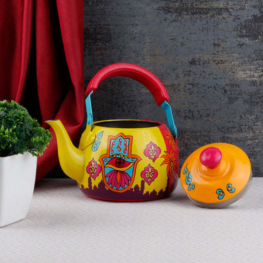 "A vibrant, handpainted kettle with quirky designs and bold colors, featuring intricate Indian folk art. The kettle is adorned with playful motifs and patterns, perfect as a decorative statement piece for a creative and culturally inspired home."